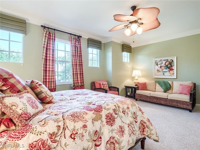 carpeted bedroom with ceiling fan and crown molding