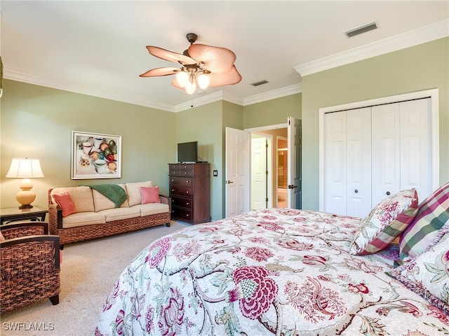 bedroom featuring ceiling fan, carpet flooring, a closet, and ornamental molding