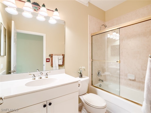 full bathroom with shower / bath combination with glass door, vanity, and toilet