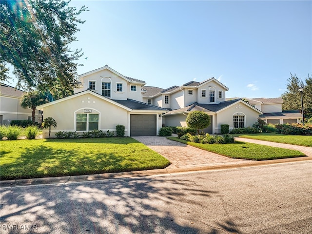 view of front property with a garage and a front yard