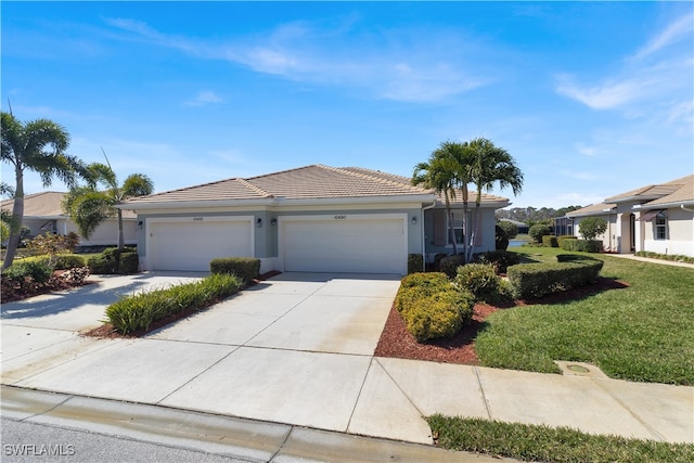 view of front of property featuring a front lawn and a garage