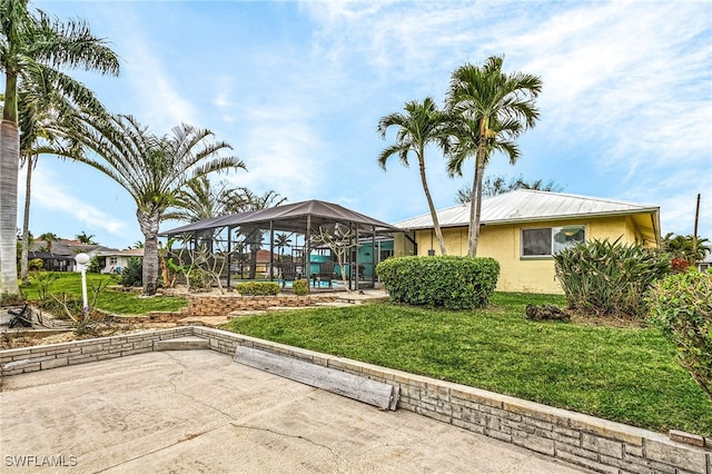 exterior space featuring a lawn, a patio area, and a gazebo