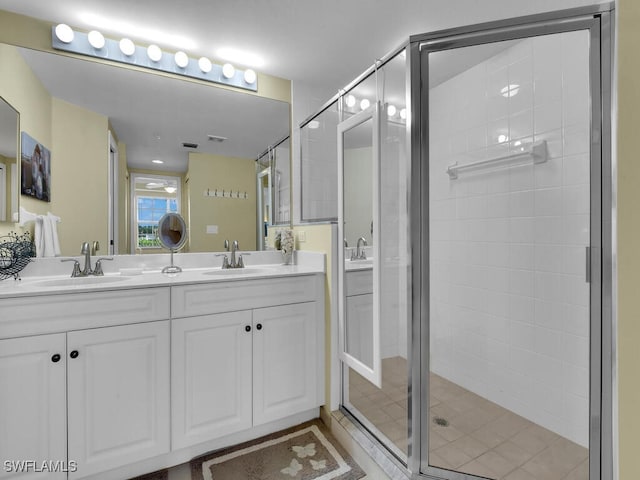 bathroom with vanity, tile patterned floors, and an enclosed shower