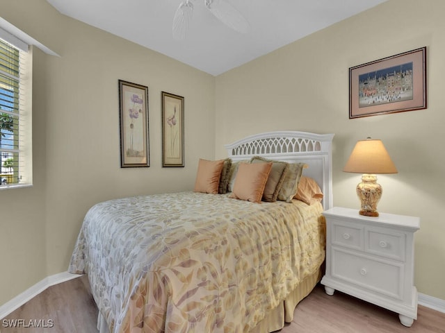 bedroom with light wood-type flooring and ceiling fan