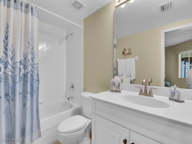 full bathroom with vanity, shower / bath combo with shower curtain, and toilet