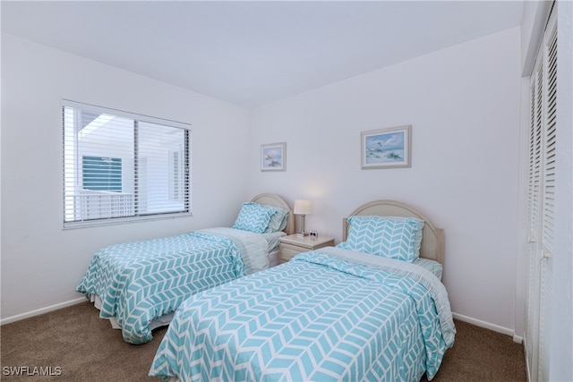 carpeted bedroom with a closet