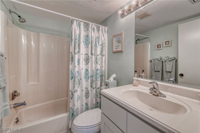 full bathroom featuring a textured ceiling, vanity, shower / bath combo with shower curtain, and toilet