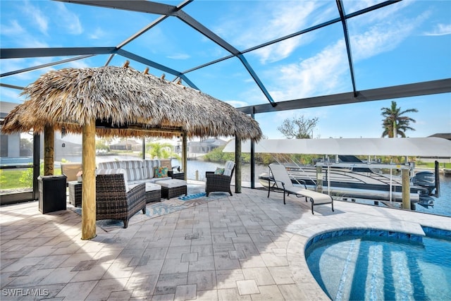 view of patio / terrace with a water view, a gazebo, a lanai, and an outdoor hangout area