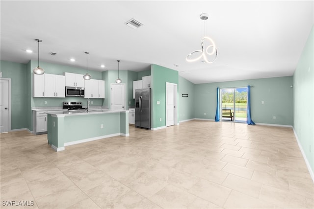 kitchen featuring pendant lighting, a center island with sink, appliances with stainless steel finishes, and white cabinetry