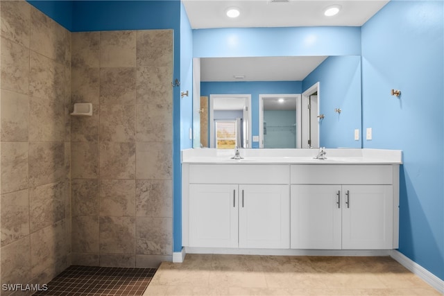 bathroom with tile patterned flooring and vanity