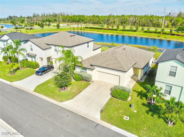 birds eye view of property with a water view