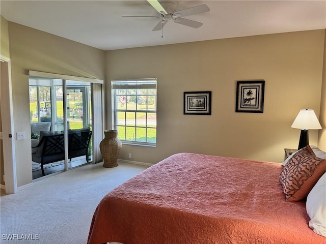 bedroom featuring carpet, access to exterior, and ceiling fan