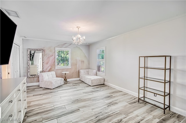 unfurnished room with light hardwood / wood-style flooring, an inviting chandelier, and crown molding