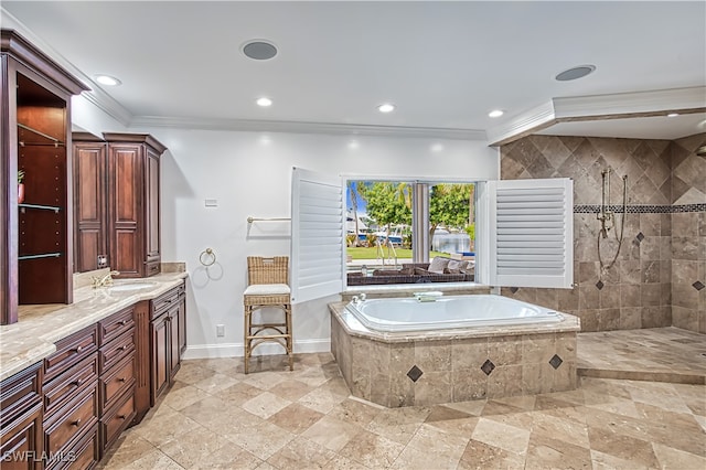 bathroom with crown molding, vanity, and separate shower and tub