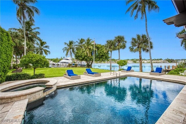 view of pool with a lawn, an in ground hot tub, a water view, and a patio