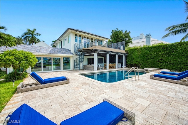 view of swimming pool with a patio