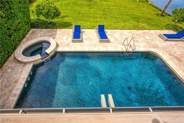 view of pool with a patio, an in ground hot tub, and a yard