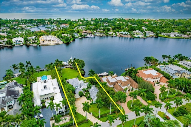 birds eye view of property with a water view