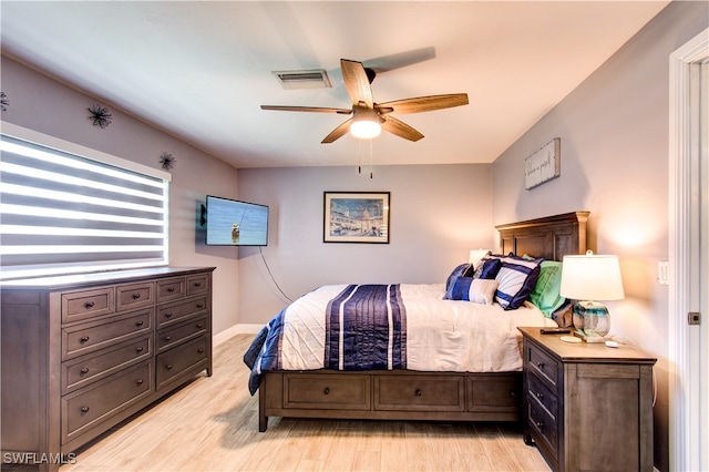 bedroom featuring light hardwood / wood-style flooring and ceiling fan