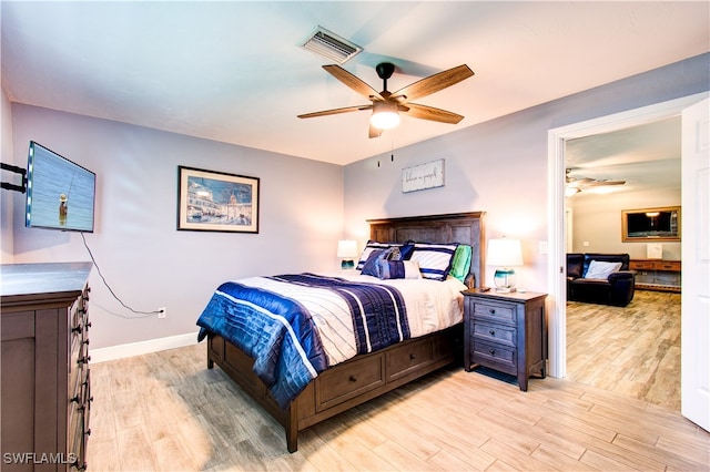 bedroom featuring light wood-type flooring and ceiling fan