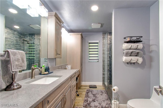 113 SE 41st St, Cape Coral, FL 33904 - bathroom featuring baseboards, a stall shower, recessed lighting, toilet, and wood finished floors