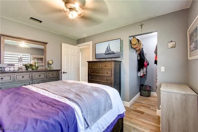 bedroom featuring light hardwood / wood-style flooring and ceiling fan