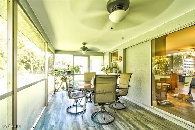 sunroom / solarium with ceiling fan