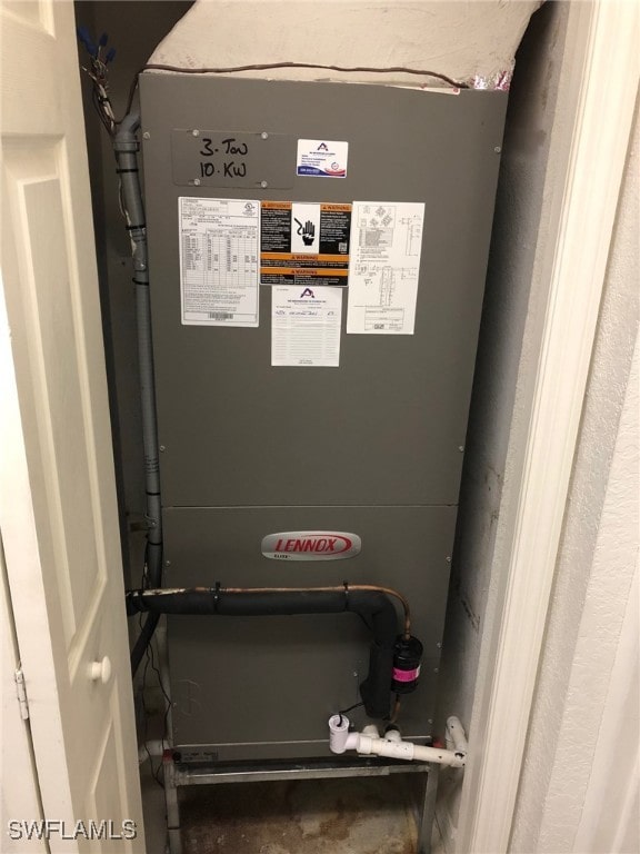 utility room featuring heating unit