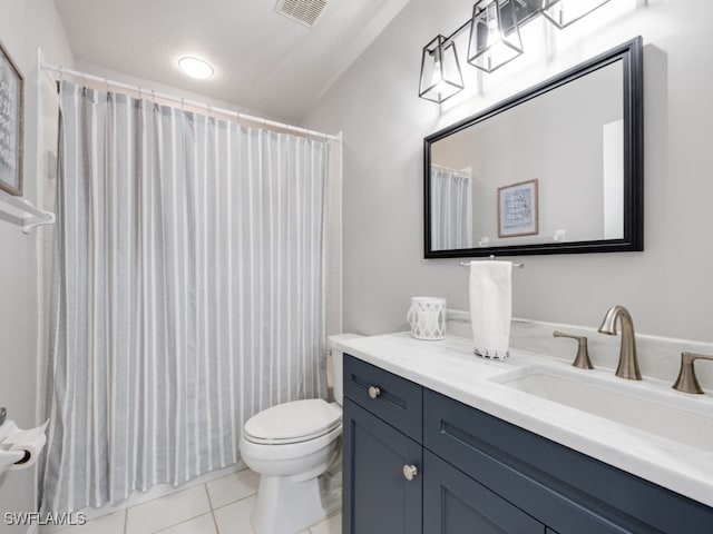 bathroom featuring a shower with curtain, vanity, toilet, and tile patterned floors