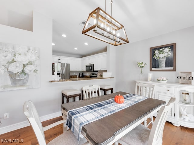 dining room featuring light hardwood / wood-style floors