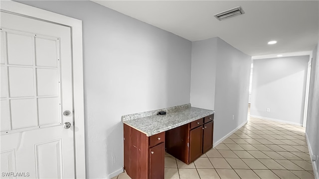 kitchen with light tile patterned flooring