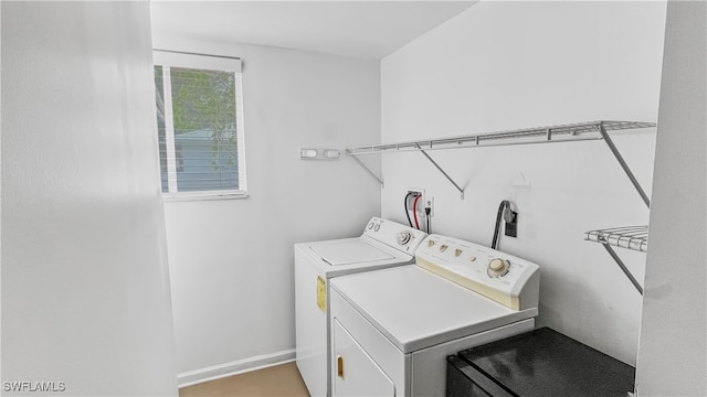 laundry area with washing machine and clothes dryer