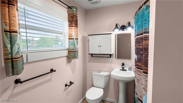 bathroom with sink and toilet