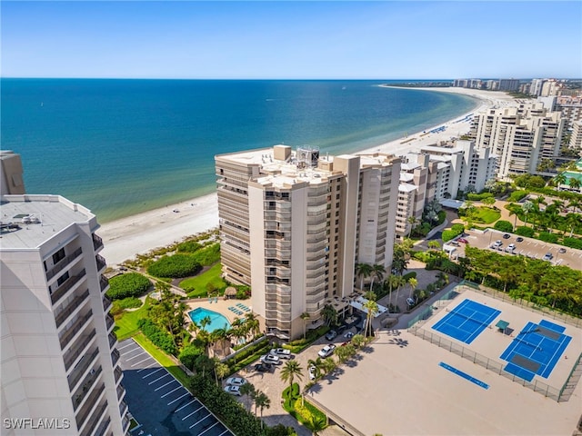 bird's eye view featuring a water view and a view of the beach