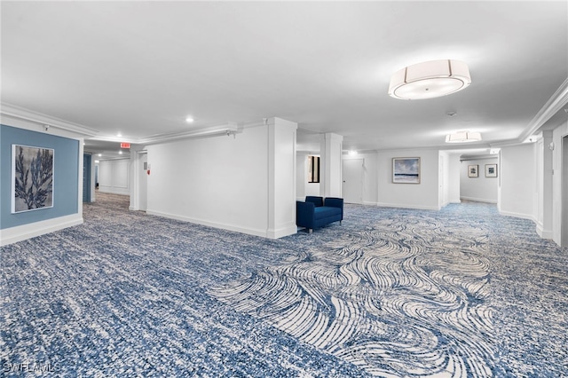 basement with crown molding and carpet flooring