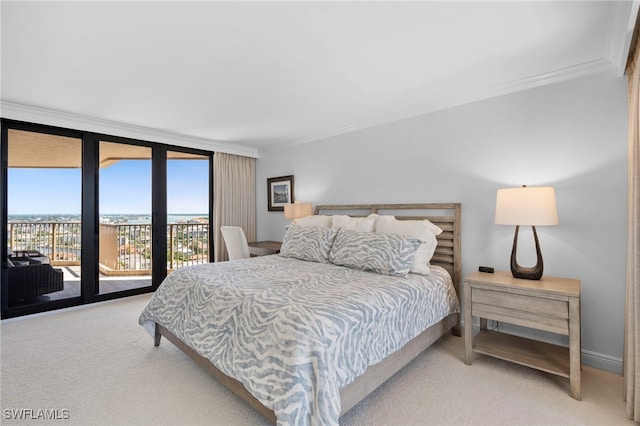 bedroom with ornamental molding, expansive windows, light colored carpet, and access to outside