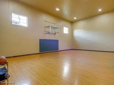 view of basketball court featuring a wealth of natural light