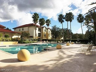 view of swimming pool featuring a patio area