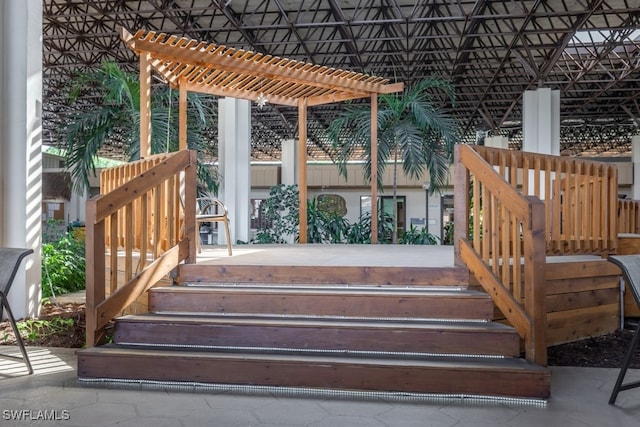 wooden deck featuring a pergola