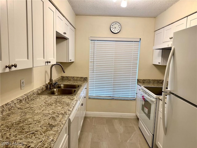 kitchen featuring a textured ceiling, white appliances, white cabinetry, and sink