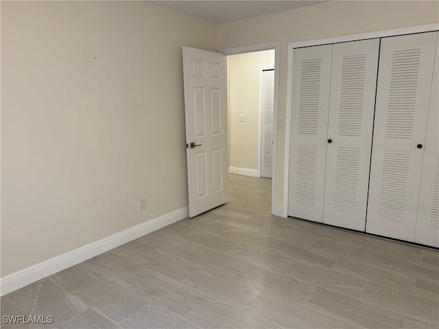 unfurnished bedroom with a closet