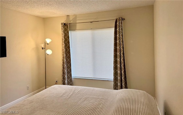 bedroom with a textured ceiling