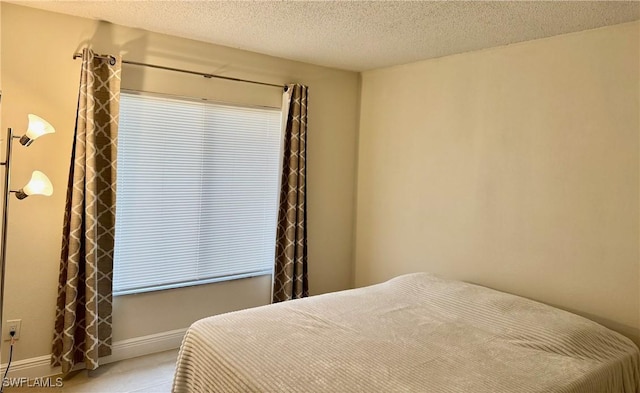 bedroom featuring a textured ceiling