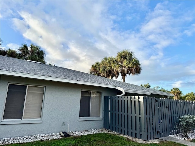 view of property exterior with a yard