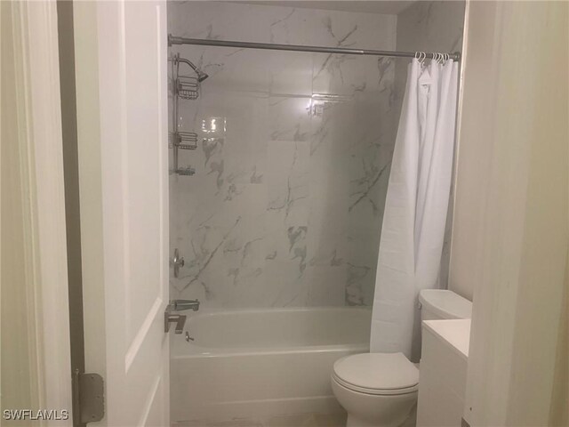 full bathroom featuring shower / bath combination with curtain, toilet, and vanity