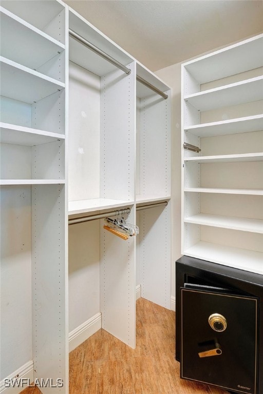 walk in closet featuring light wood-type flooring