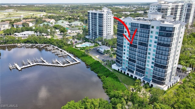 birds eye view of property with a water view