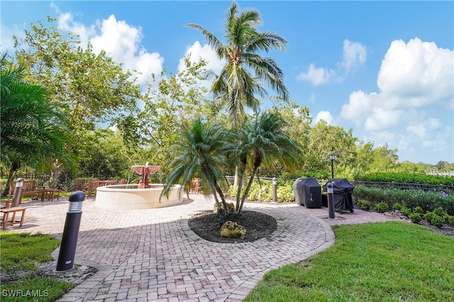 surrounding community featuring a patio