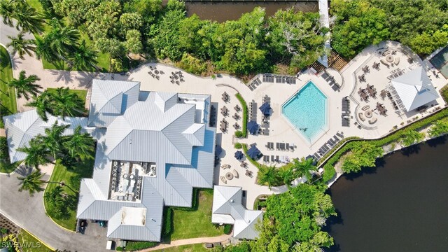 birds eye view of property with a water view