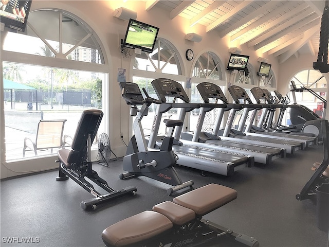 exercise room featuring lofted ceiling and wooden ceiling